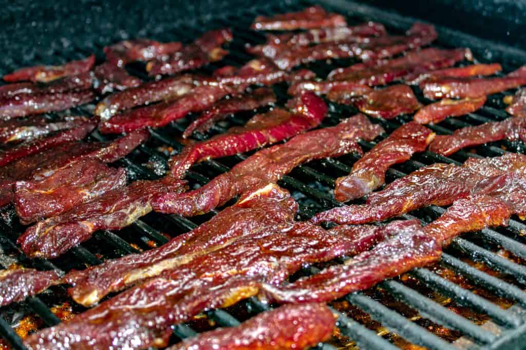 Smoked Goose strips on the grill grates