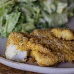 Traeger Walleye with a side salad on a plate