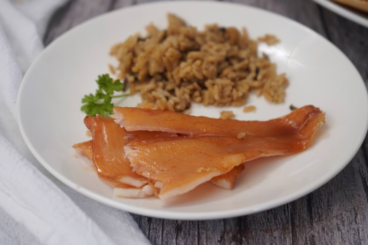 smoked trout on plate with rice