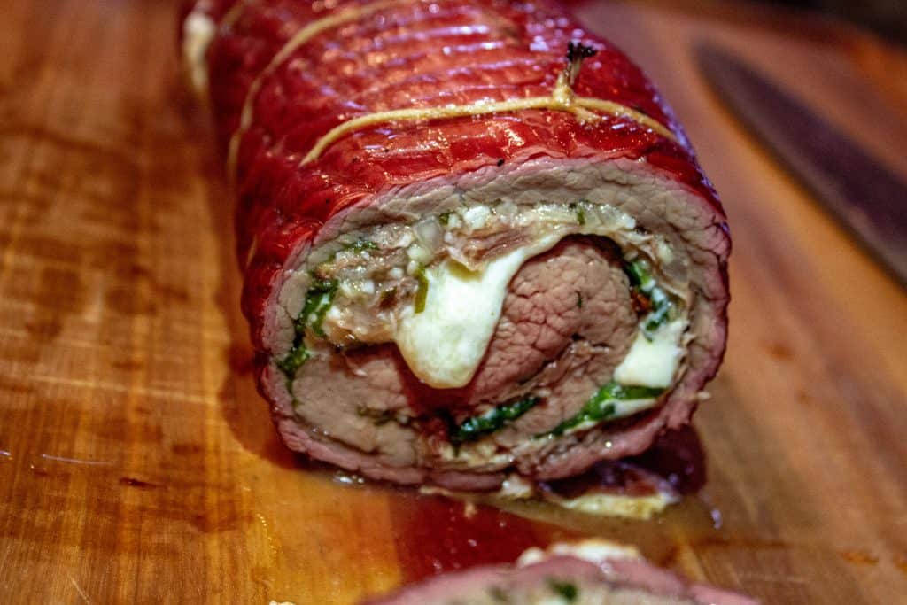 Cheese oozing out of a Flank Steak pinwheel