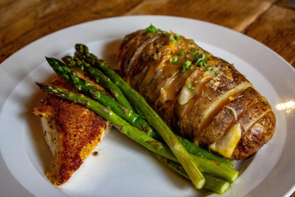 Smoked Whole Chicken Breast with Asparagus and Hasselback Potatoes