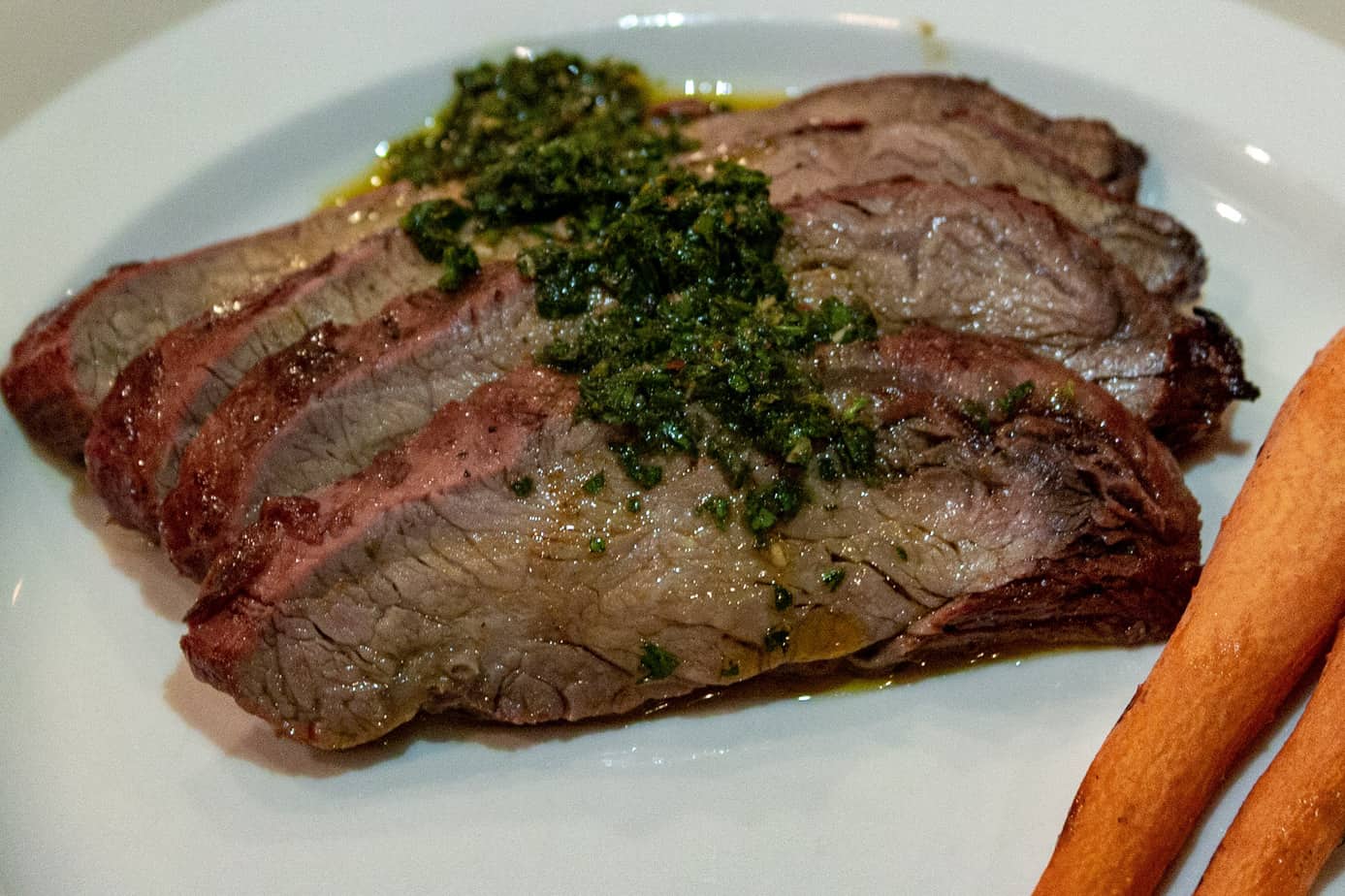 Smoked Flank Steak with carrot top chimichurri
