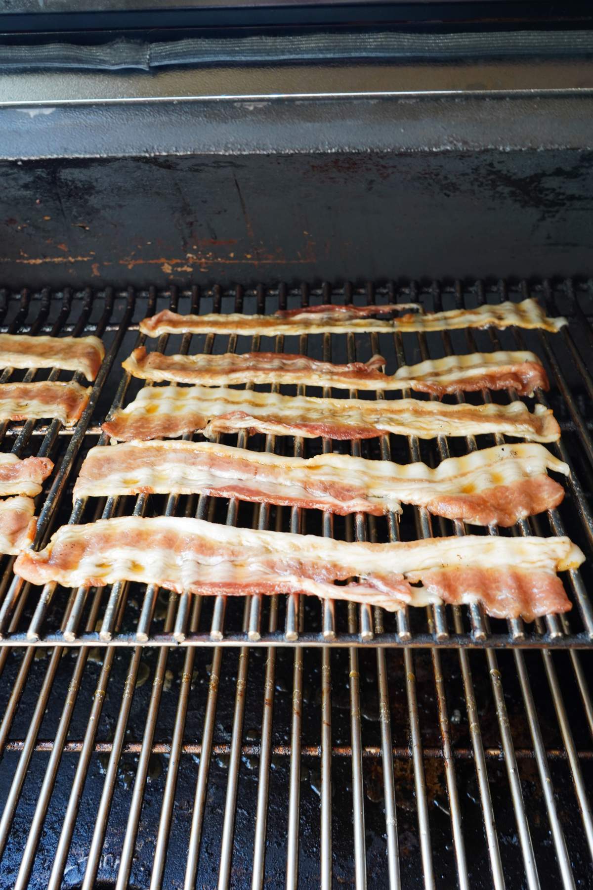 Candied bacon in smoker.
