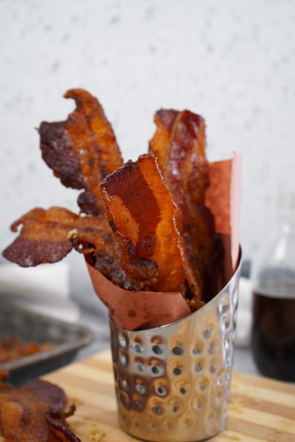Candied bacon slices in holder.