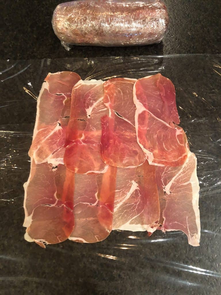 prosciutto on plastic wrap