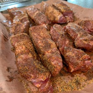 uncooked 4" strips of boneless country style ribs with a bbq rub added