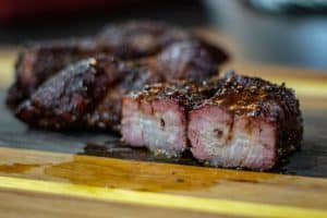 smoked country style pork ribs with a good bark and a light bbq sauce glaze