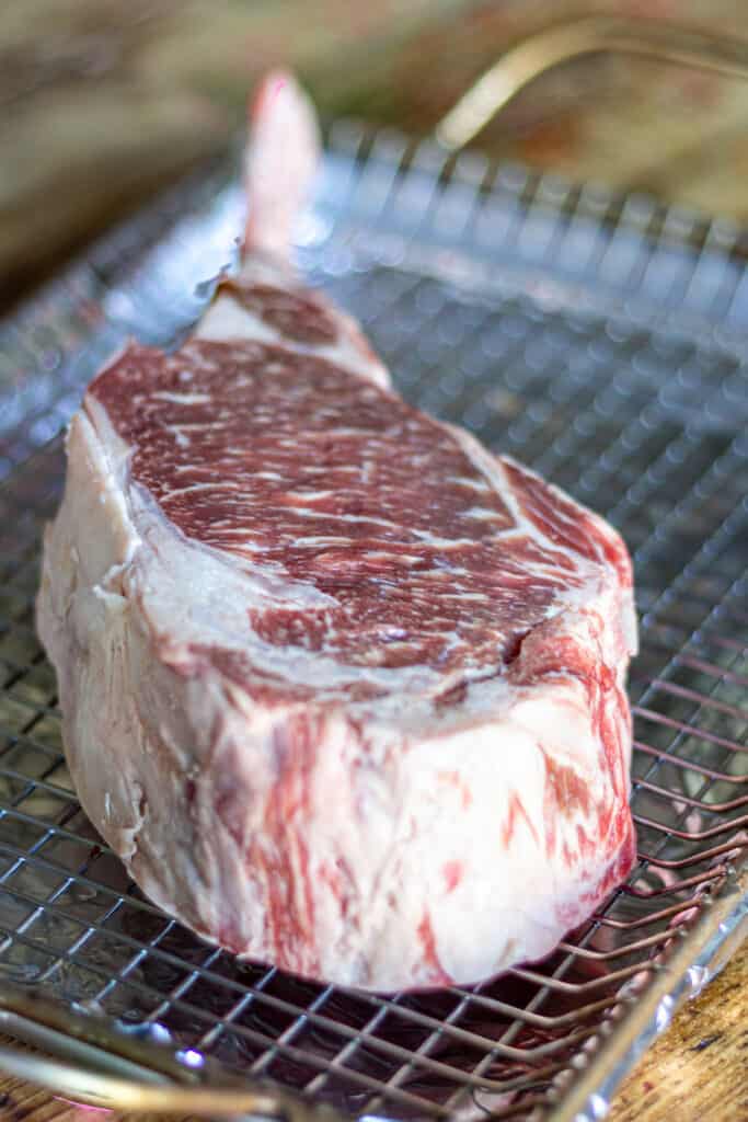 Tomahawk Steak on a grill rack