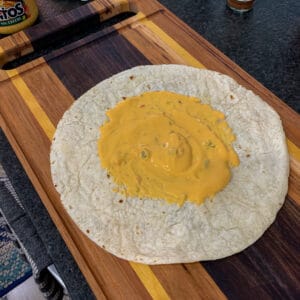tortilla and queso for pulled pork crunch wrap