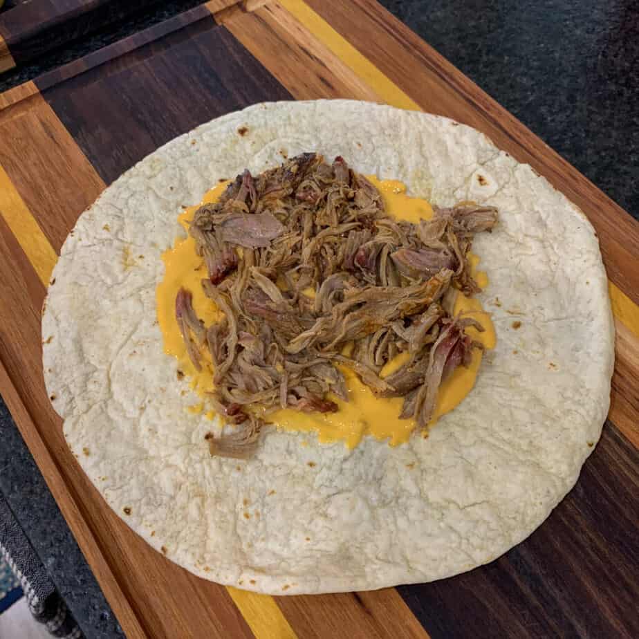 tortilla, queso, and pulled pork  for pulled pork crunch wrap