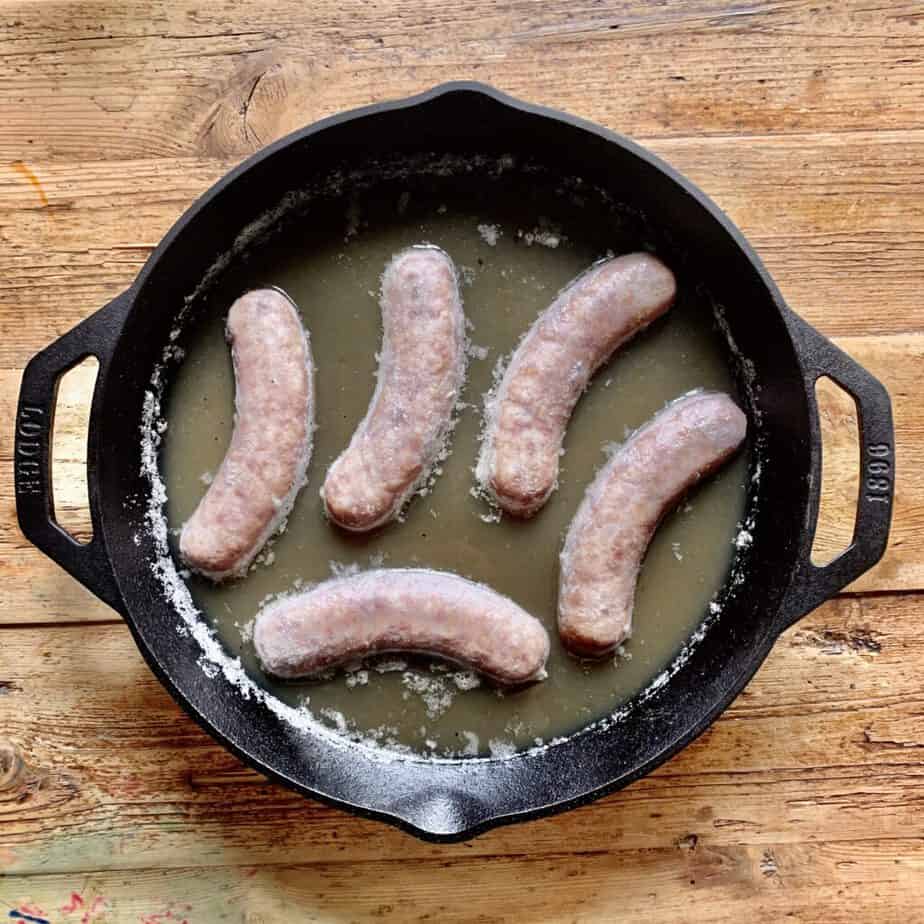 brats in a skillet with beer
