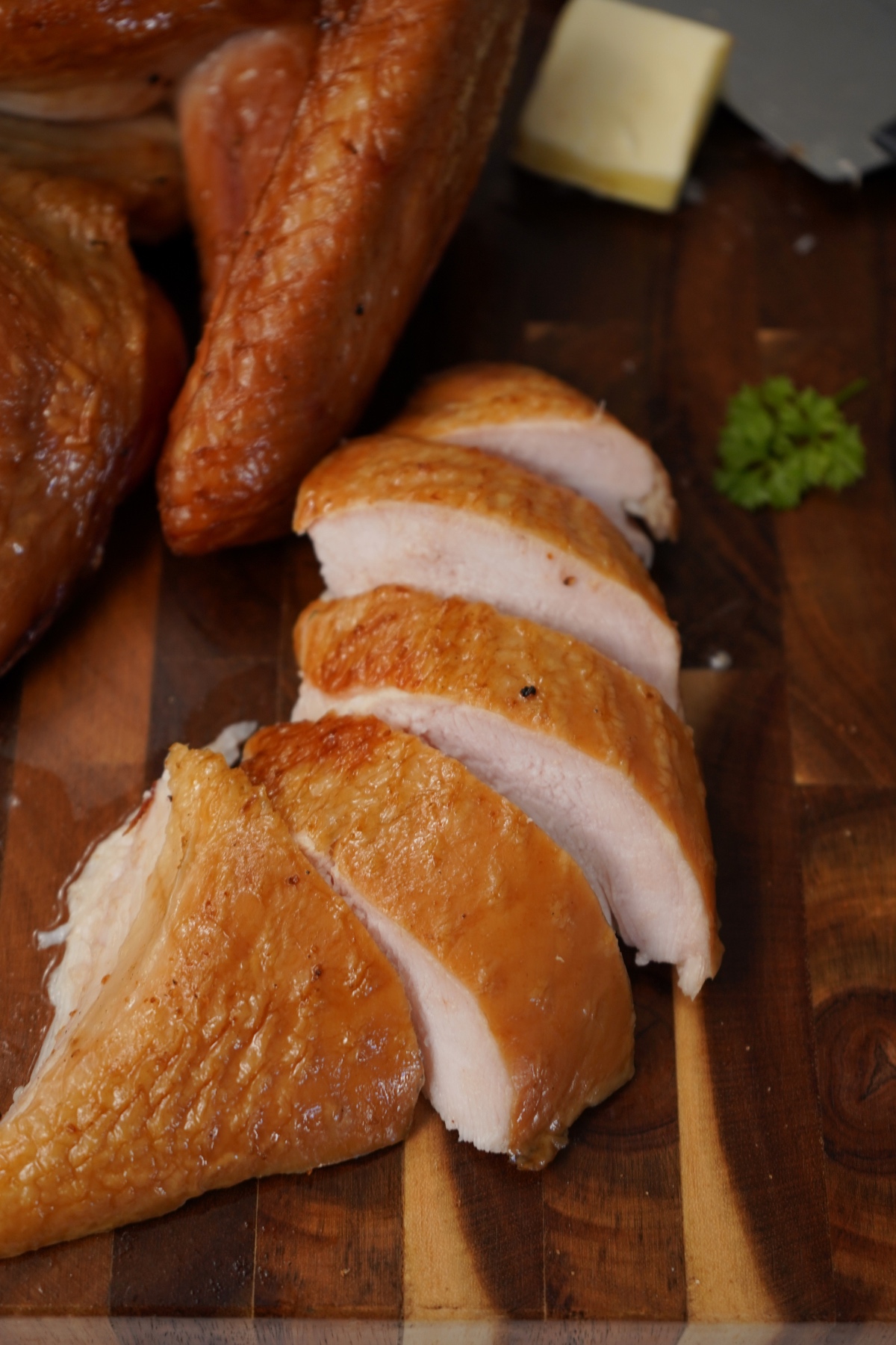 Turkey breast sliced on cutting board