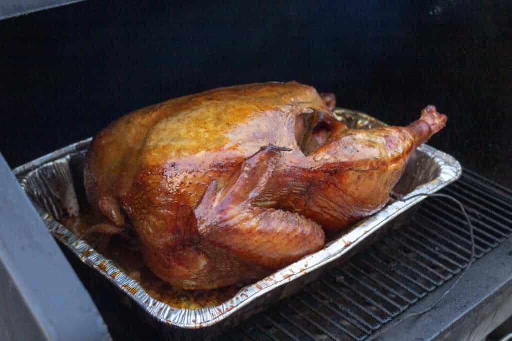 Traeger Smoked Turkey turkey smoking on a pellet grill