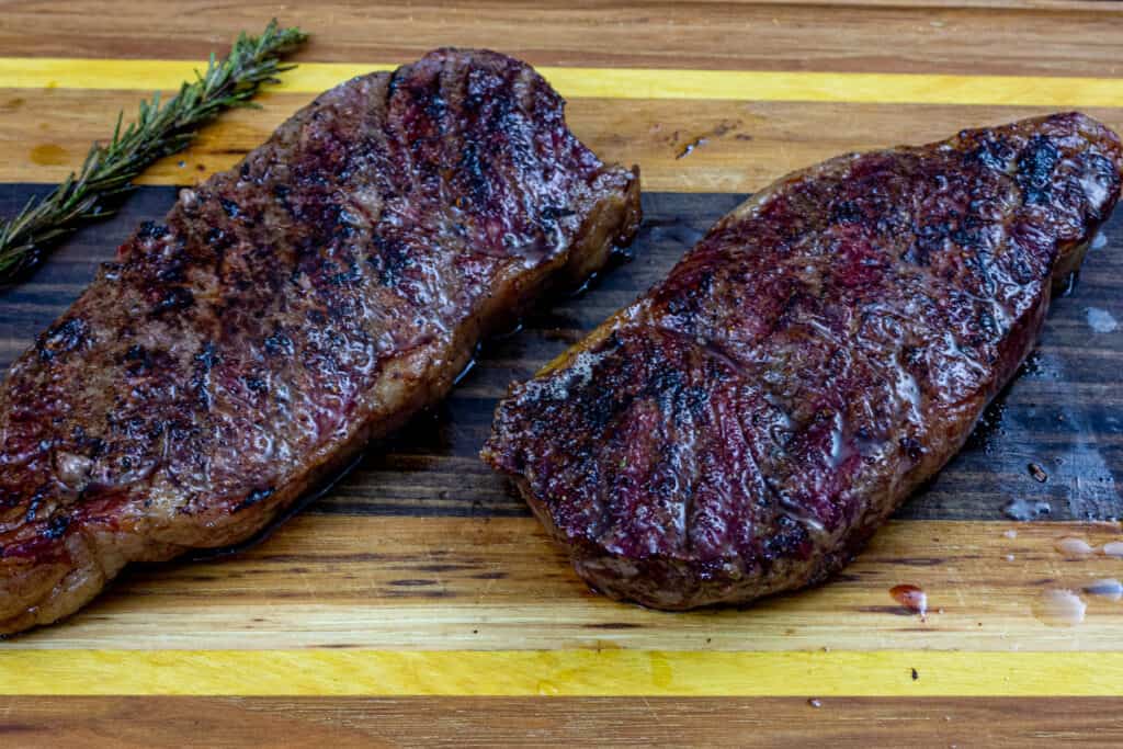 smoked new york strip steak on a cutting board