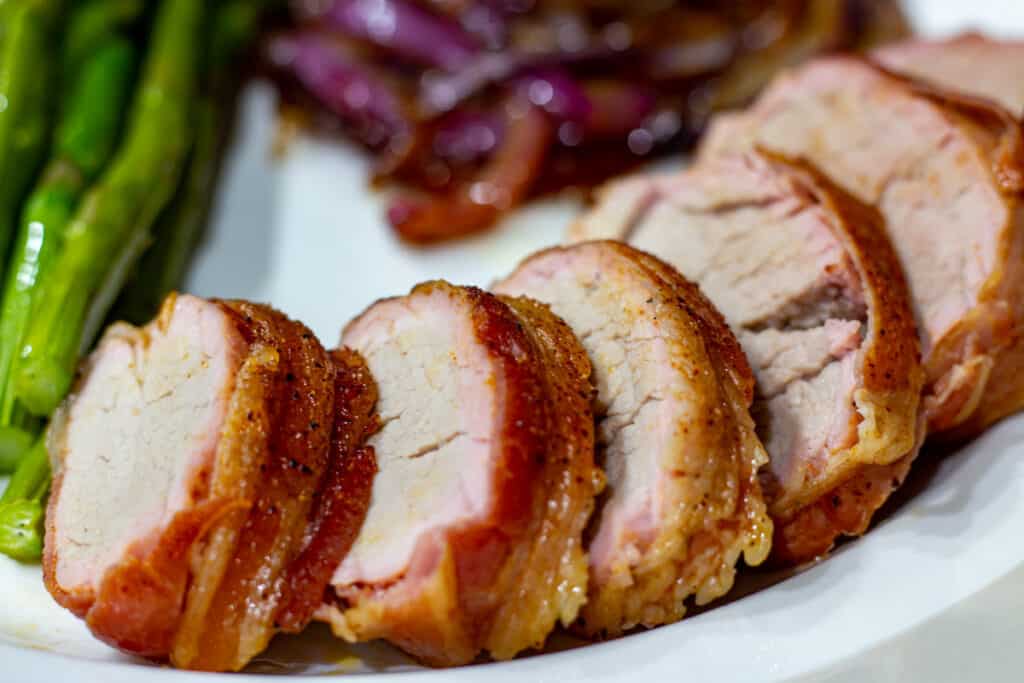 sliced bacon wrapped pork tenderloin