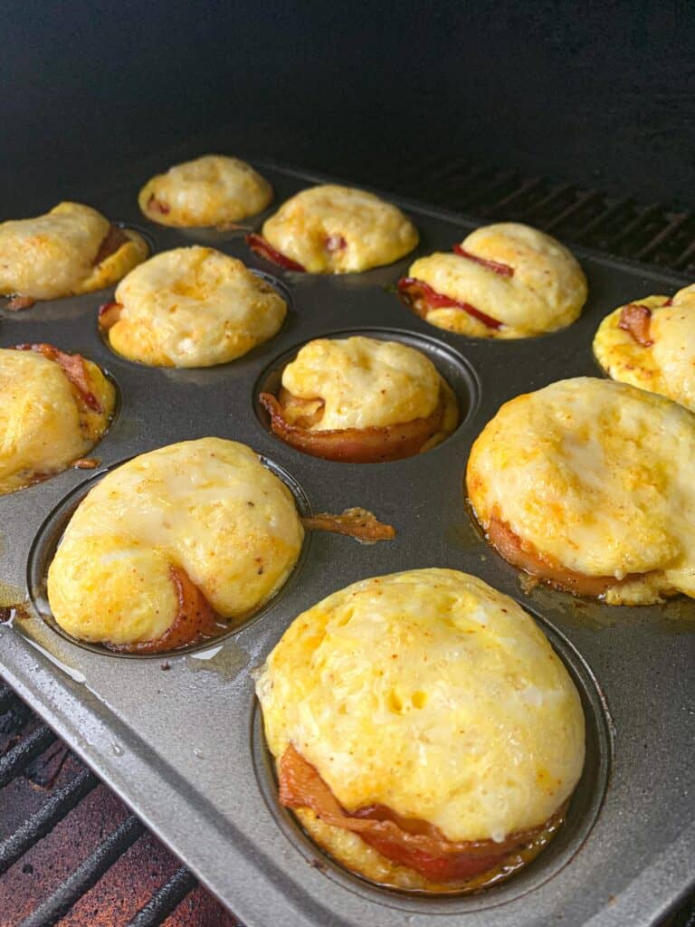 bacon and cheese egg bites ready to come out of the smoker