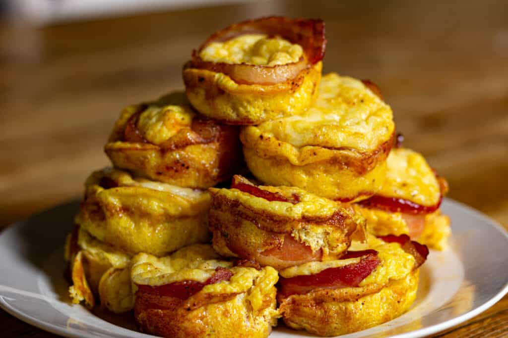 smoked bacon egg and cheese bites in a pile on a plate