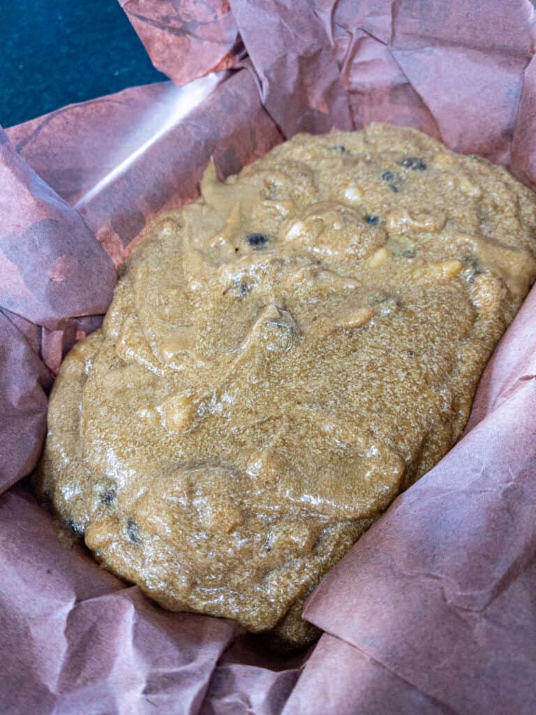 banana bread batter in a loaf pan