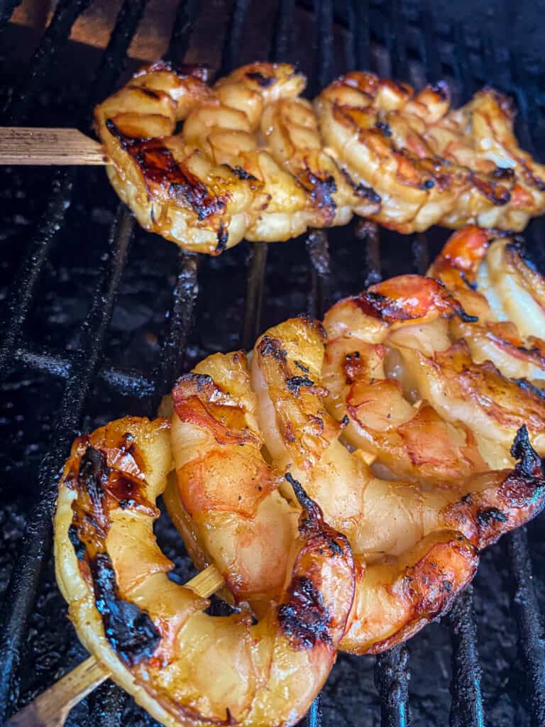 ten minute sweet and spicy shrimp skewers on a grill