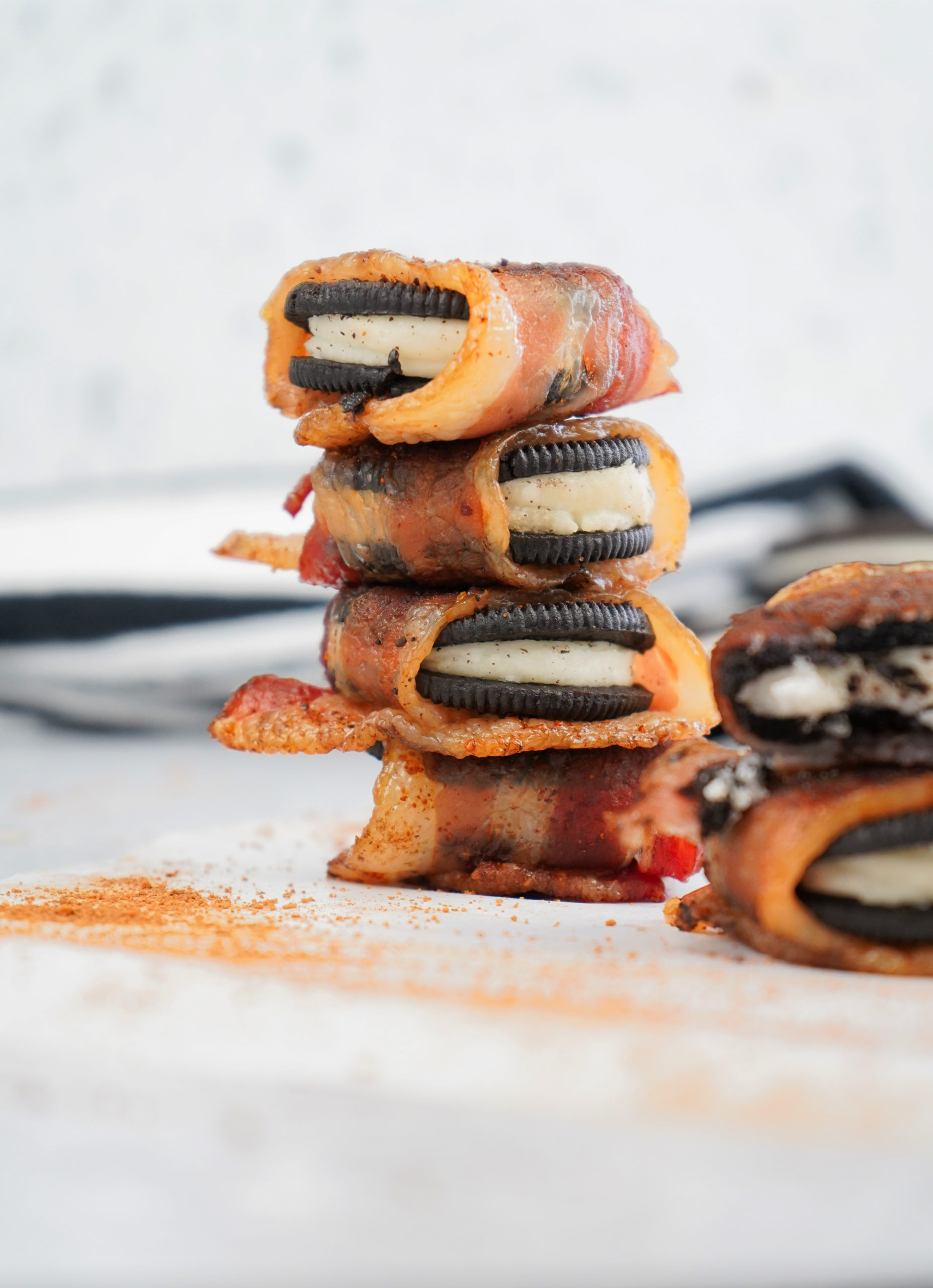 Bacon around smoked oreos stacked.