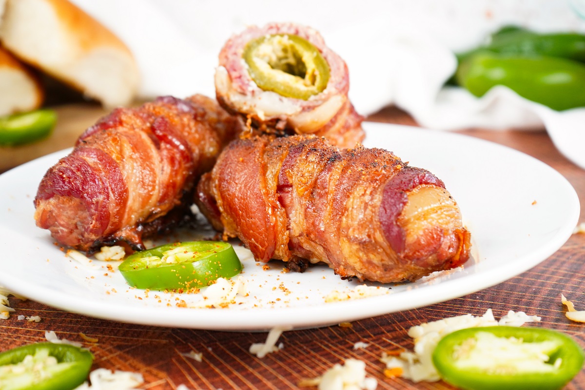 Smoked armadillo eggs on white plate 