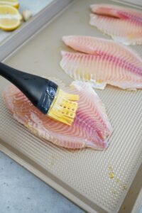 Brush each tilapia filet with olive oil and sprinkle with blackening seasoning