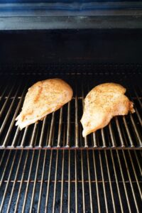 Transfer out to the smoker and place the chicken directly on the grates