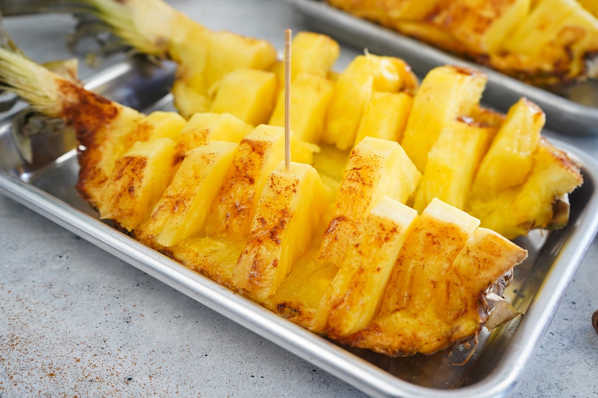 Cinnamon Honey Smoked Pineapple with toothpick. 