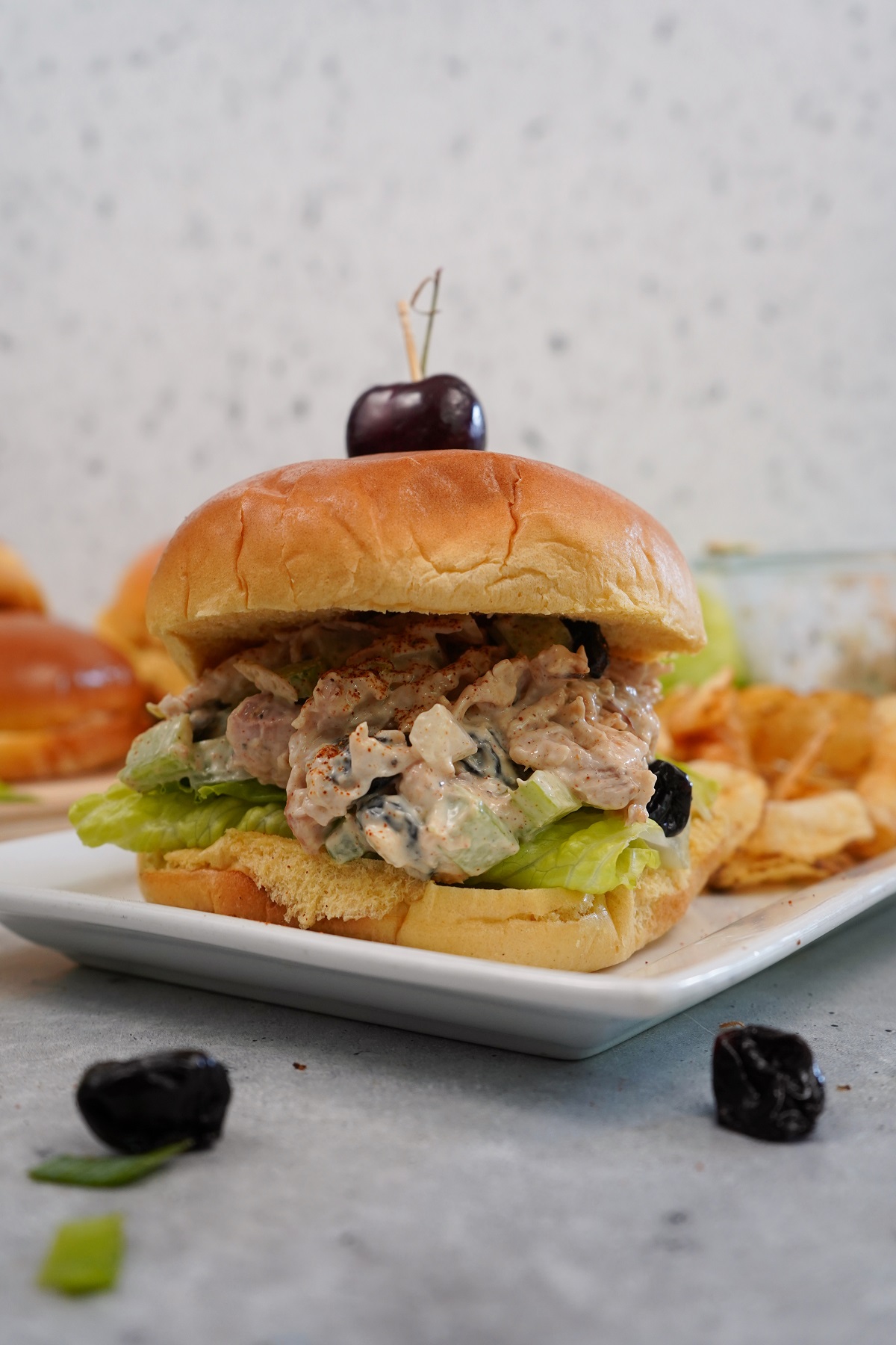Smoked cherry chicken salad stacked high on a bun. 
