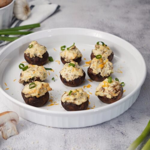 Smoked stuffed mushrooms on white platter