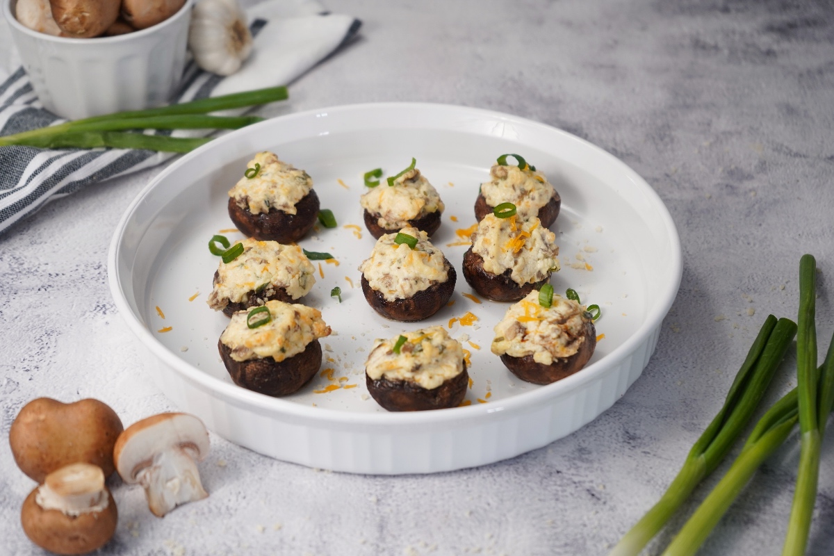 Smoked stuffed mushrooms on white platter