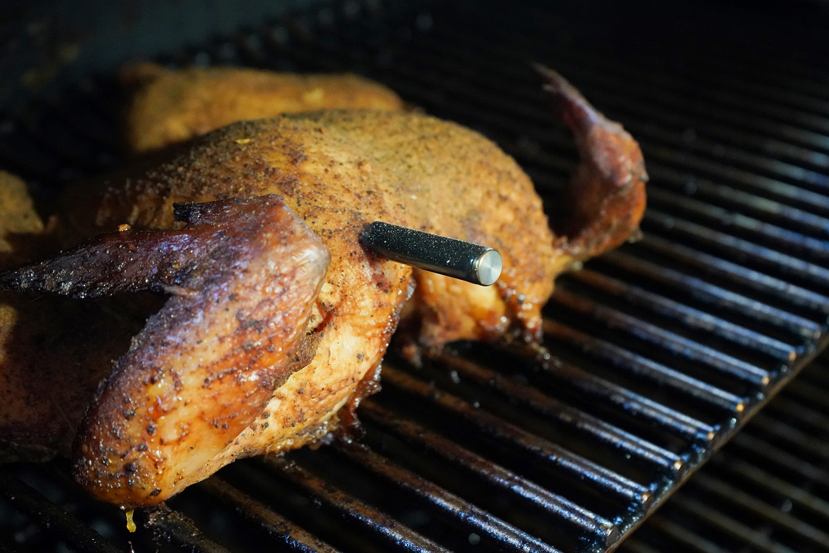 The Meatstick Test in a whole chicken on smoker. 