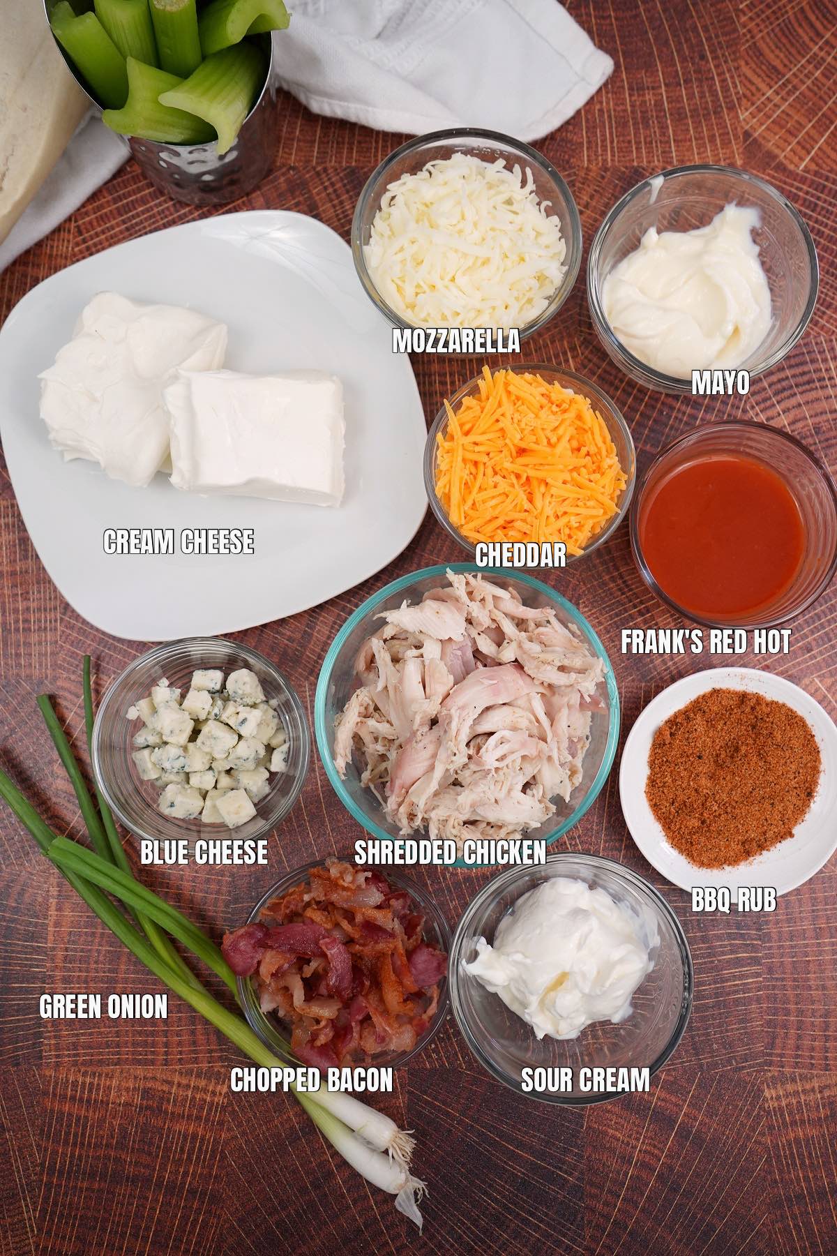 Labeled ingredients in dishes for chicken dip. 