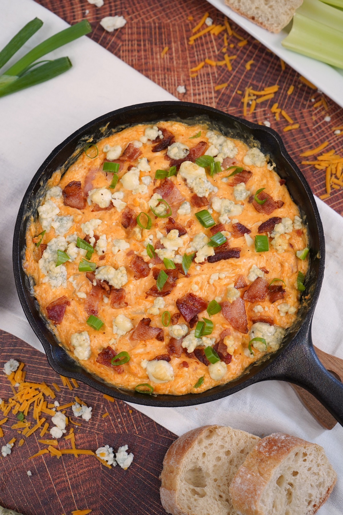 Buffalo chicken dip with blue cheese and green onions on top. 