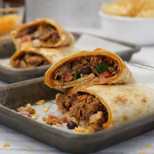 Cheesy Pulled Pork Burritos on Silver Platters