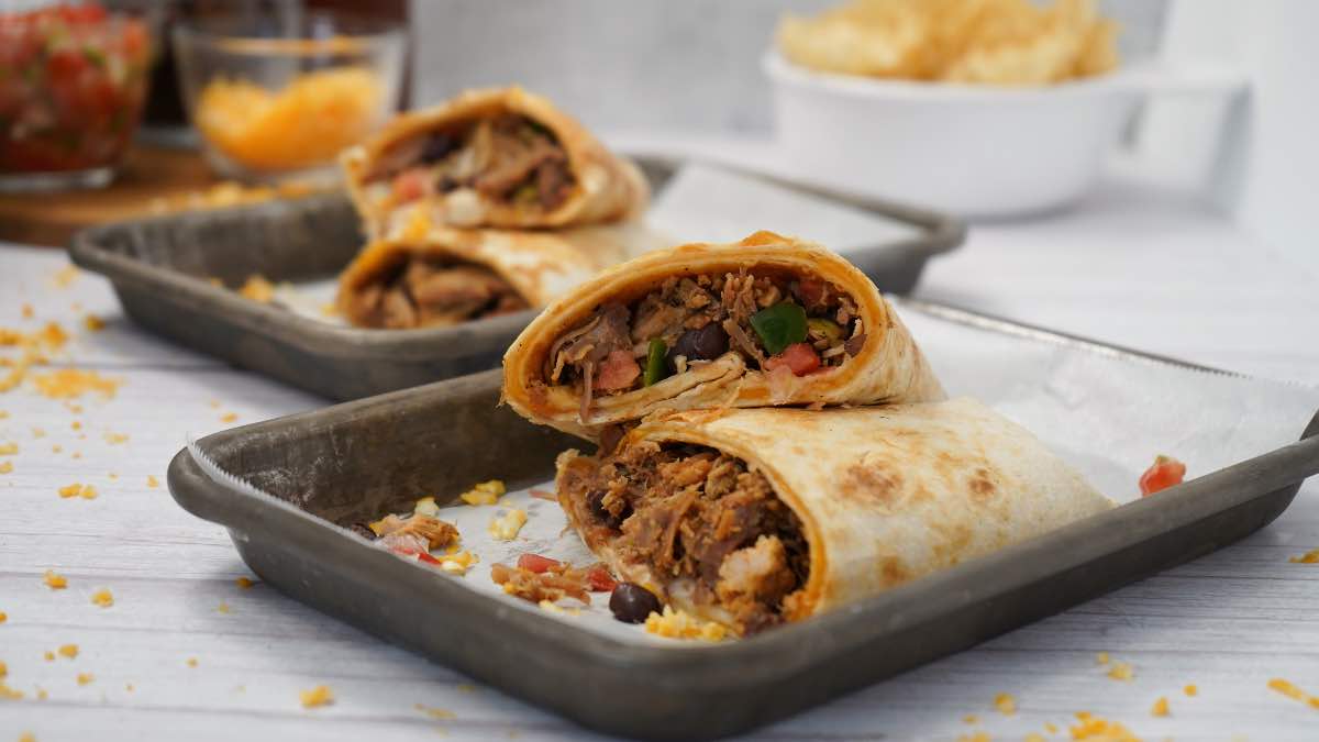 Cheesy Pulled Pork Burritos on Silver Platters