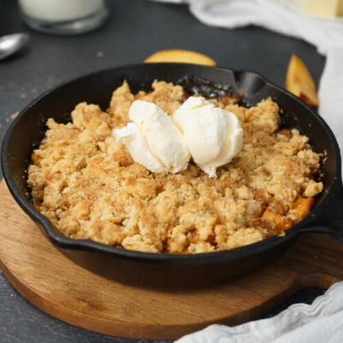 Smoked Peach Cobbler in skillet