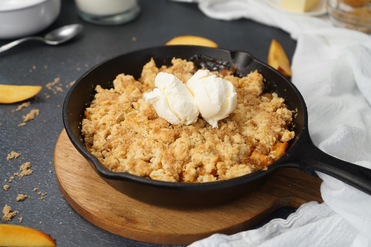 Smoked Peach Cobbler in skillet