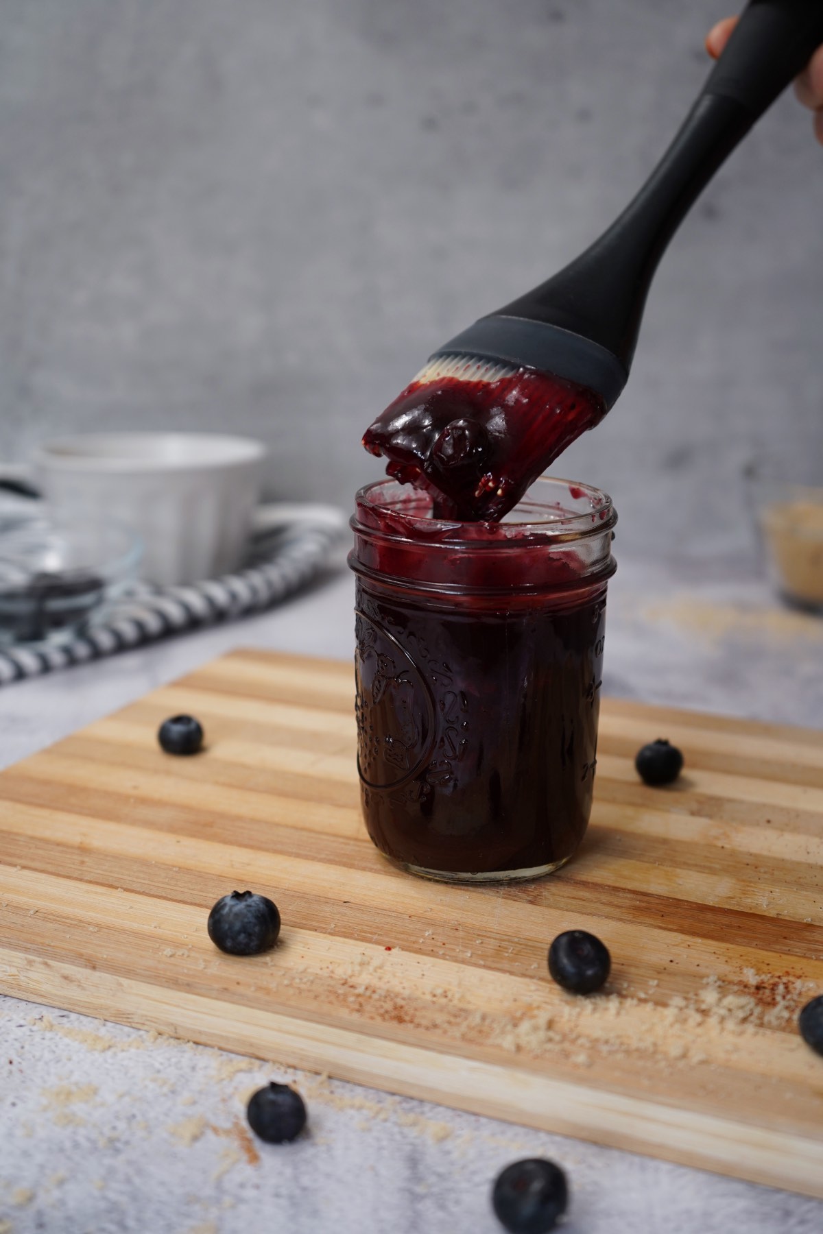 Mason jar filled with blueberry bbq sauce