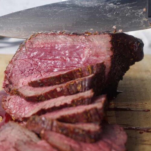 Smoked rump roast being sliced